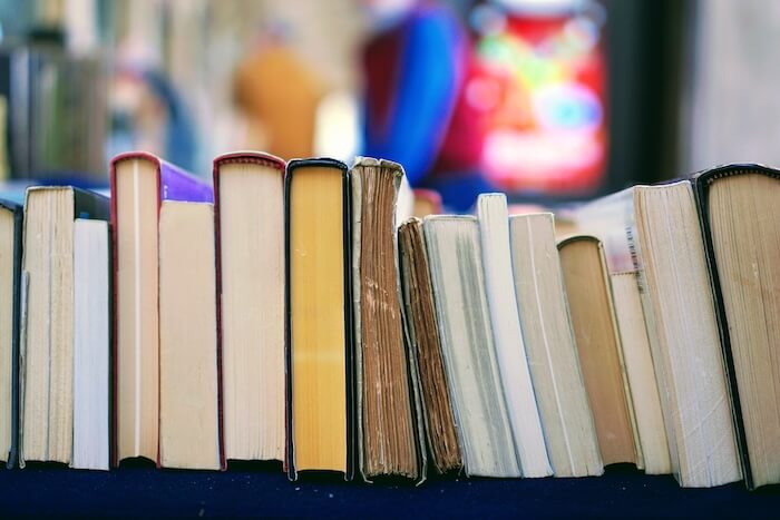 Selection of books stacked horizontally.